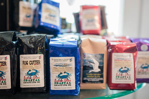 Packages of coffee placed on a shelf in store